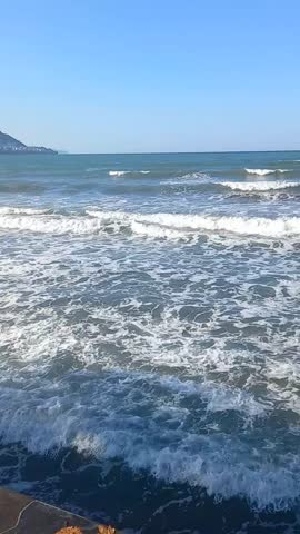 Sea waves at windy weather. Wavy beach