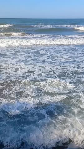 Sea waves at windy weather. Wavy beach