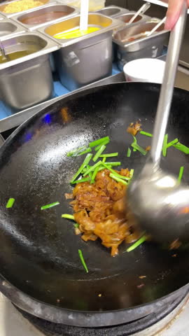 wok cooking, making Thai stir fried noodles (pad see ew)