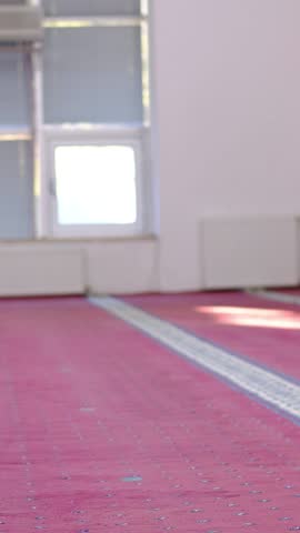 Muslim man masked praying with his forehead ground, man who believes in islam prays in mosque, islam is a holy religion