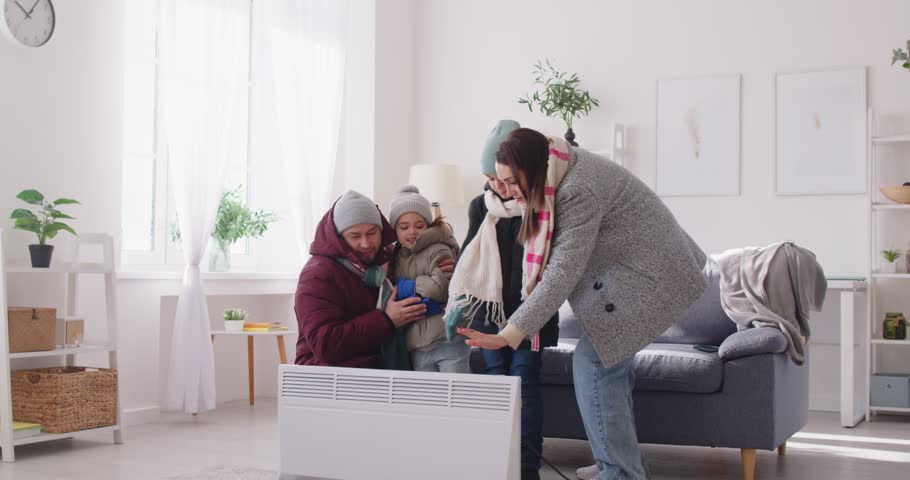 Unhappy at home, badly frozen in freezing cooled flat wearing warm coat, shivering tremble with cold, feels bad, suffer of heating system problem, climate, temperature regulation, no central heating