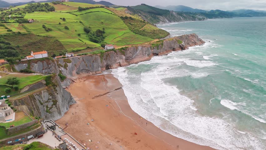 Aerial view of the beautiful Itzurun beach, Zumaia town, Basque country, north of Spain. Itzurun beach is famous for the longest set of continuous rock strata in the world