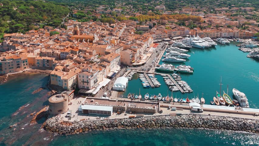 Aerial view of Saint-Tropez in summer, a famous tourist destination on the Cote d'Azur in the Alpes-Maritimes department, southern France. A luxury travel hotspot on the French Riviera.