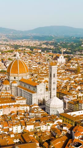 Vertical video. Florence, Italy. Cathedral Santa Maria del Fiore. Panoramic view of the city. Summer. Evening, Aerial View, Point of interest. Rich colors