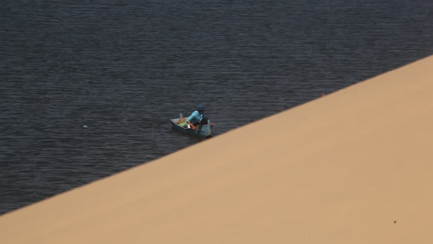 Fishermen at the white sand dunes of Mui Ne, Vietnam.