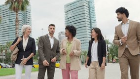 Business, multiethnic, people, financial Diverse business team collaborating outdoors for strategic walk-and-talk - Powered by Shutterstock - Get 15% off with code: PIKWIZARD15