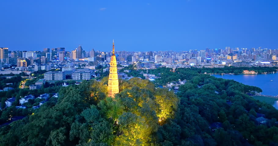 Aerial shot of modern cityscape of downtown buildings and lake in Hangzhou, China