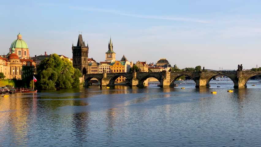 Scenic view of the Old Town pier architecture and Charles Bridge over Vltava river in Prague, Czech Republic. Prague iconic Charles Bridge (Karluv Most) and Old Town Bridge Tower at sunset, Czechia.