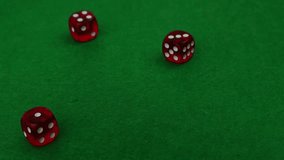 Casino dice spin and bounce slowly on green casino table cloth, slow motion - Powered by Shutterstock - Get 15% off with code: PIKWIZARD15