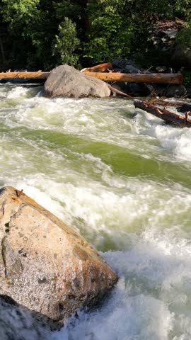 River Rapids in the Merced River as it runs through Yosemite National Park in California. This video Loops seamlessly. Vertical Video.