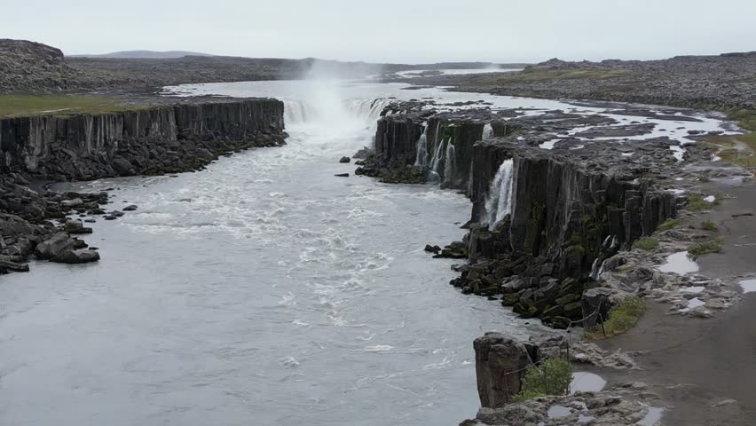Aerial view of Godafoss or Waterfall of the Gods of Iceland. The beauty of nature, a cascade of waterfalls, a tourist spot beyond the Arctic Circle. High quality 4k footage