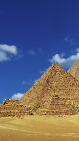 Timelapse with clouds over great pyramids in Egypt . Vertical video