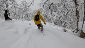 POV: Two snowboarders carve through fresh snow in Hokkaido’s scenic backcountry. A snowboarder in a yellow jacket weaves between trees, capturing dynamic action and untouched powder in stunning detail - Powered by Shutterstock - Get 15% off with code: PIKWIZARD15