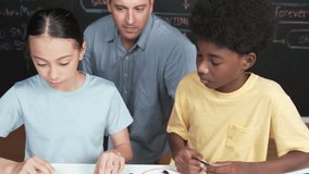 Smart mentor teach main board construction while diverse teenager learning system. Teacher explain about motherboard structure while academic student learning to use electronic equipment. Edification - Powered by Shutterstock - Get 15% off with code: PIKWIZARD15