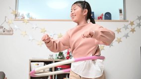  A child playing with a hula hoop - Powered by Shutterstock - Get 15% off with code: PIKWIZARD15