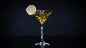Martini glass with lime slice on black backdrop - Powered by Shutterstock - Get 15% off with code: PIKWIZARD15