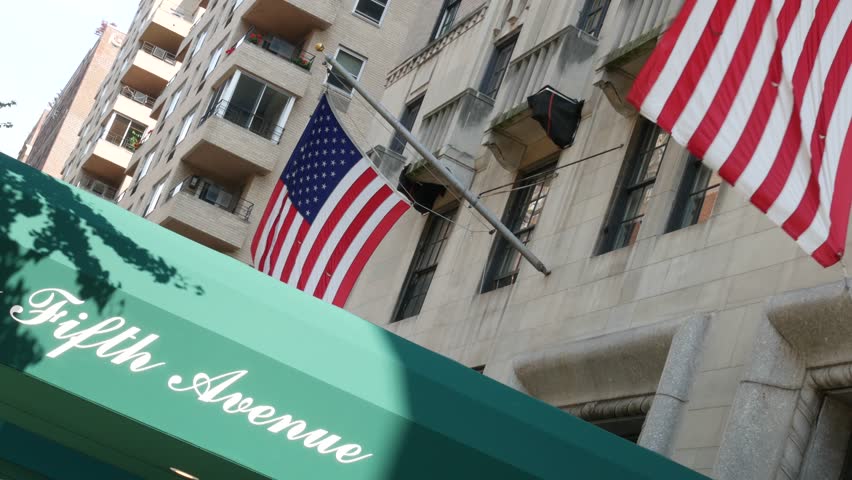 Fifth avenue, 5 ave sign, Manhattan midtown architecture, New York City 5th av. Real estate, residential property in USA. Classic building entrance signage. United States of America flag.