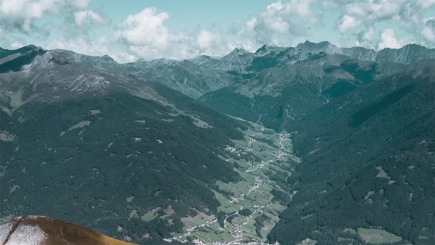 Mountainous Landscape with Winding Path and Dense Forest