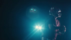 An American football player practicing throwing and catching the ball on a field - Powered by Shutterstock - Get 15% off with code: PIKWIZARD15