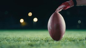 Cinematic shot of American Football player Kickoff Game Start. Static Close-up of Ball Being Kicked by the Professional Player. Gates Goal Kick. Successful Team Scores and Wins Championship. - Powered by Shutterstock - Get 15% off with code: PIKWIZARD15