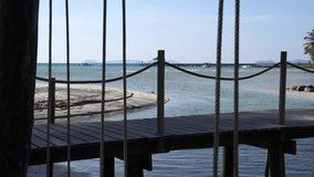 Wooden walkway jetty on the beach with rope foreground. - Powered by Shutterstock - Get 15% off with code: PIKWIZARD15