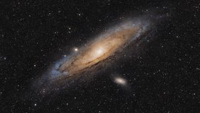 Cosmic Travel. An Interstellar Journey through the Depths of Space. Animation of a real astronomical photograph of Andromeda galaxy M31 captured by me. High quality 4k footage - Powered by Shutterstock - Get 15% off with code: PIKWIZARD15