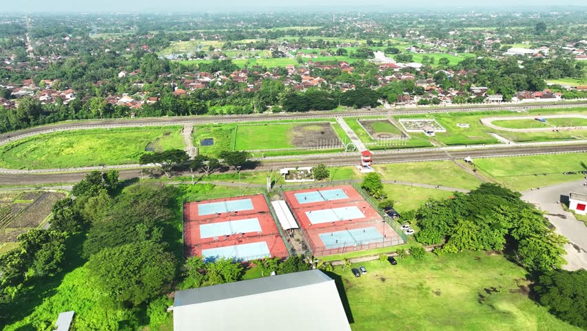 Aerial footage of playing outdoor tennis in the morning