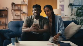 Young couple makes a video call to their family on the phone, staying connected - Powered by Shutterstock - Get 15% off with code: PIKWIZARD15
