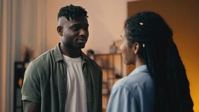 Young Black couple reconciles after a conflict, as the man hugs wife lovingly - Powered by Shutterstock - Get 15% off with code: PIKWIZARD15