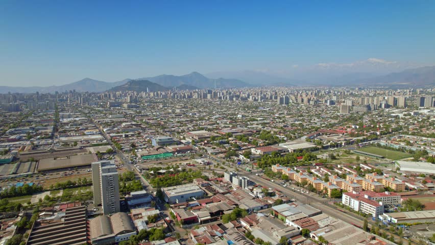 Aerial establishing, Santiago de Chile residential neighborhood, Andean mountain background at daylight, South American Capital