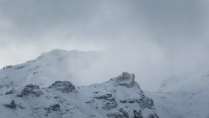 Timelapse of clouds blowing over snow covered peaks in Denali National Park, Alaska, near Mt. McKinley