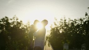 Father lifting his child outdoors at sunset. Concept Parental love - Powered by Shutterstock - Get 15% off with code: PIKWIZARD15