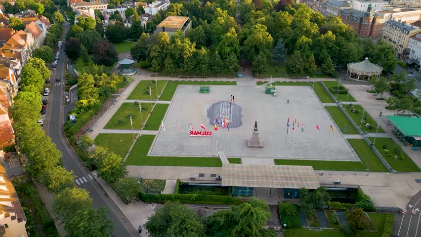 4K Aerial Drone Video of the Beautiful Fountains and Carousel at Parc du Champ de Mars Park in Colmar, France