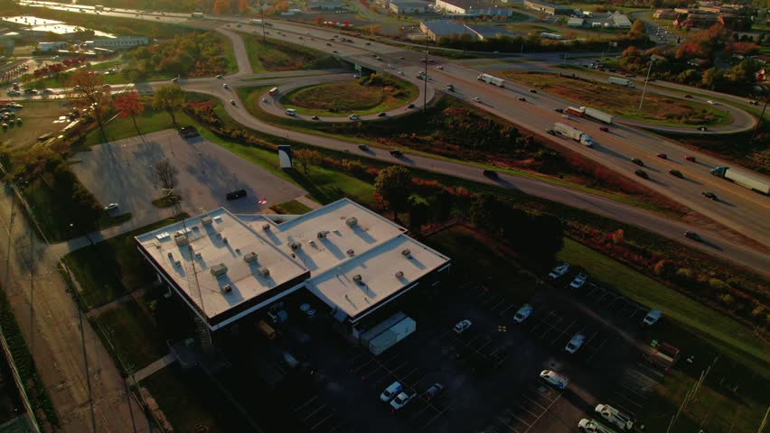 Highway interchange and exit ramp on I-70 in the eastern suburbs of Indianapolis, Indiana, during autumn.