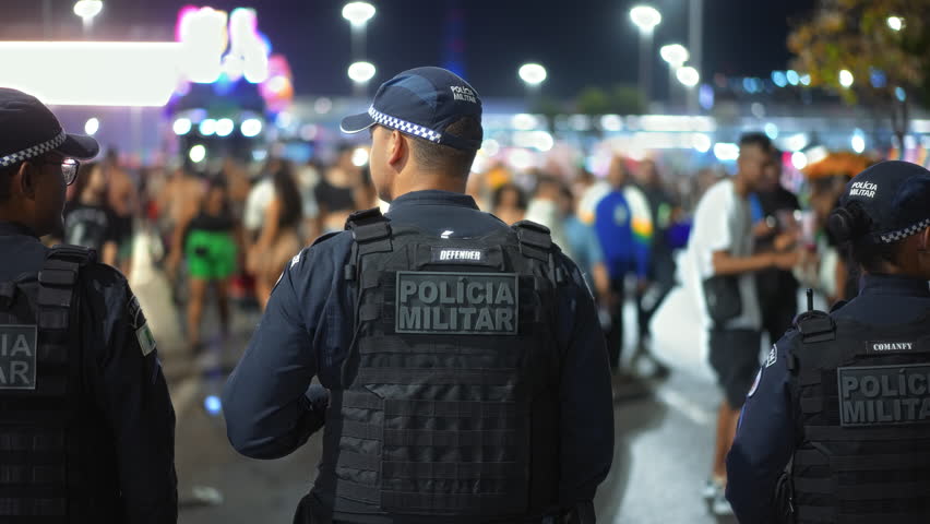 Brazilian policeman group patrol city street. Military police officers defend urban area. Armed men guard brazil public place. Male blue special forces uniform. People keep order. Civil defense job.