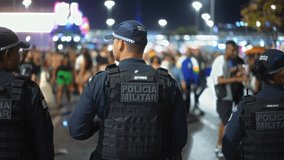 Brazilian policeman group patrol city street. Military police officers defend urban area. Armed men guard brazil public place. Male blue special forces uniform. People keep order. Civil defense job. - Powered by Shutterstock - Get 15% off with code: PIKWIZARD15