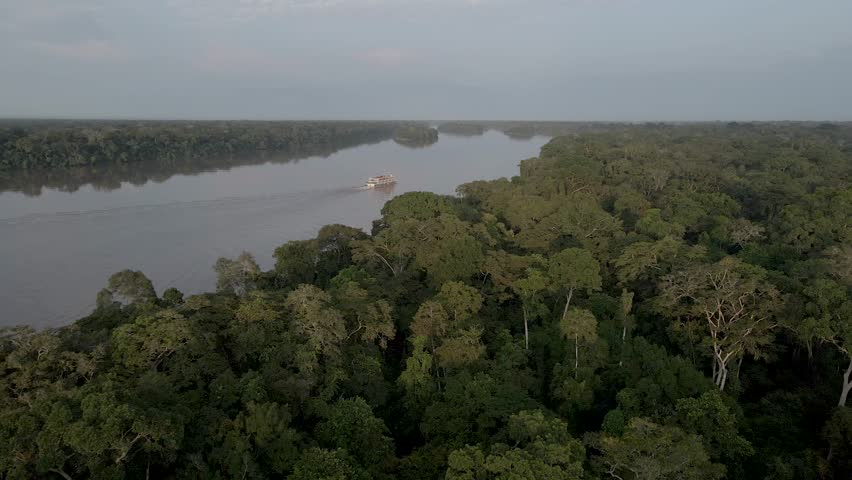 Aerial view of the cruise ship crossing the congo basin rainforest in the democratic republic of Congo.