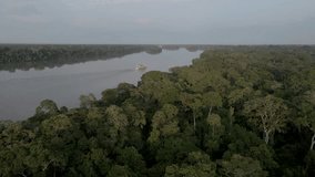 Aerial view of the cruise ship crossing the congo basin rainforest in the democratic republic of Congo. - Powered by Shutterstock - Get 15% off with code: PIKWIZARD15
