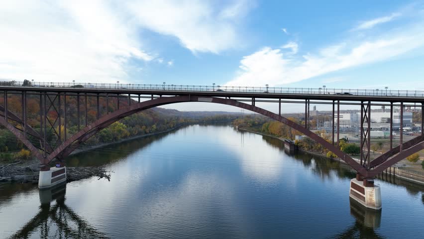 Drone flying down the Smith Avenue High bridge and above Mississippi river near St Paul in Minnesota, USA.