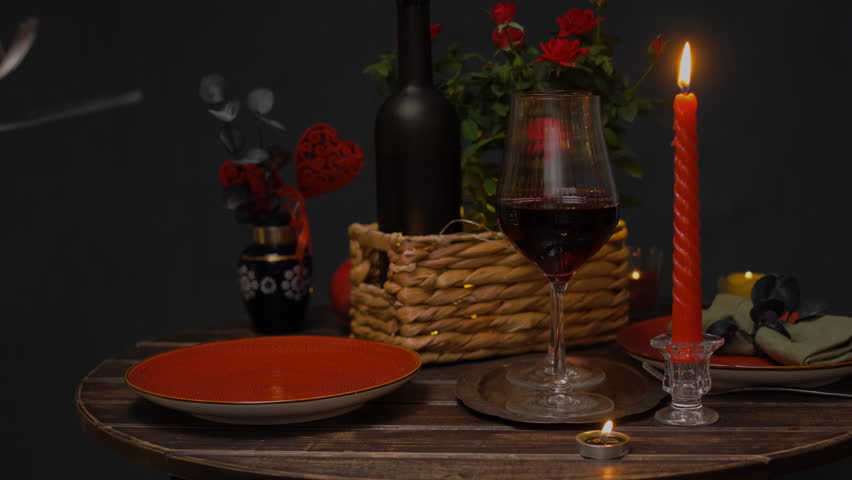 Female hands prepare table for Valentine