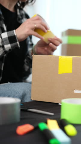 Girl Packing Cardboard Box For Shipping Then Sealing Box Online Shopping With Delivery, Vertical Video