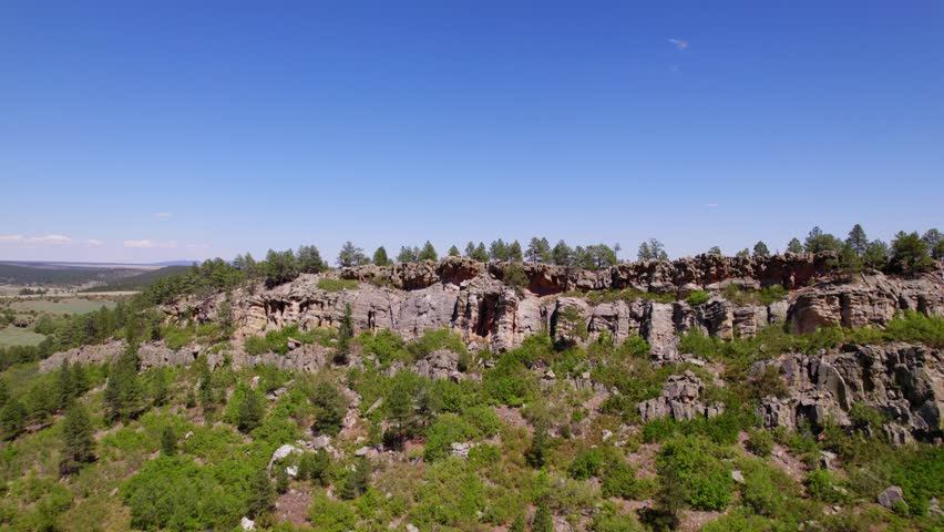 Aerial View of New Mexico Rock Face Revealing Open Grassland