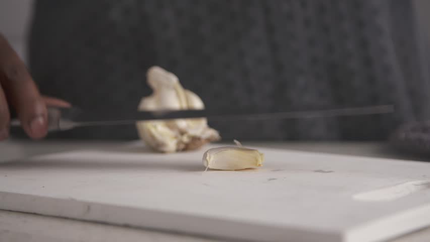 Crushing Garlic Clove using a Chef's Knife