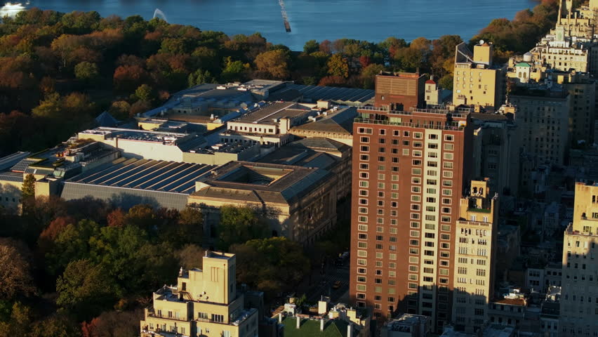 Camera moving over the Metropolitan Museum of Art in Manhattan, New York City on a sunny autumn day. Central Park and Manhattan iconic venue