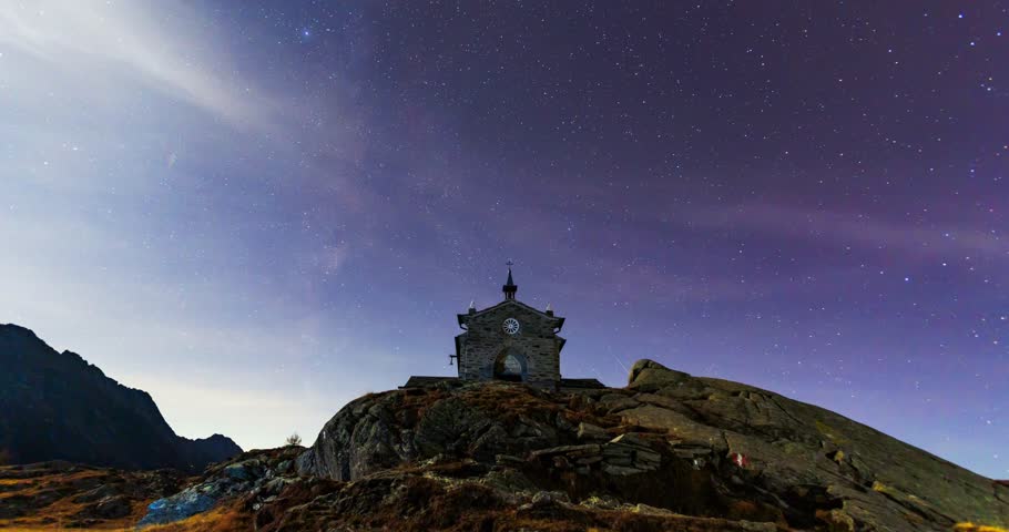 Magical timelapse video of star trails over a stone chapel in Prabello. The celestial movement contrasts beautifully with the rugged mountain landscape