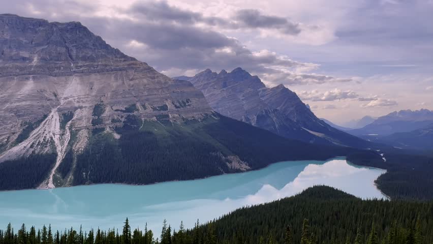 Breathtaking view of Peyto Lake’s turquoise waters nestled among the rugged peaks of the Rocky Mountains in Banff National Park, Alberta, Canada