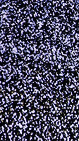 Close up view at a plasma tv while showing white noise