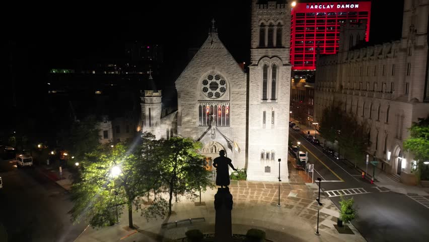 Drifting backwards as the Cathedral of the Immaculate Conception and the surrounding neighborhood becomes part of the frame