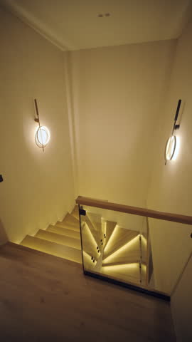 Stylish and elegant minimalist home interior featuring clean lines, neutral colors, and warm ambient lighting, creating a cozy and modern atmosphere.