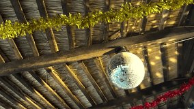 Spinning disco ball under a thatched roof - Powered by Shutterstock - Get 15% off with code: PIKWIZARD15